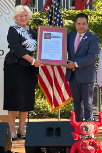 Susanne T. Stirling (left) accepting the California Senate Resolution, presented by Senator Steve Padilla