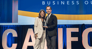 Maryam Brown, 2025 CalChamber chair, presents the Chamber of the Year Award to Evan Sanford, executive director of the Redlands Chamber of Commerce.